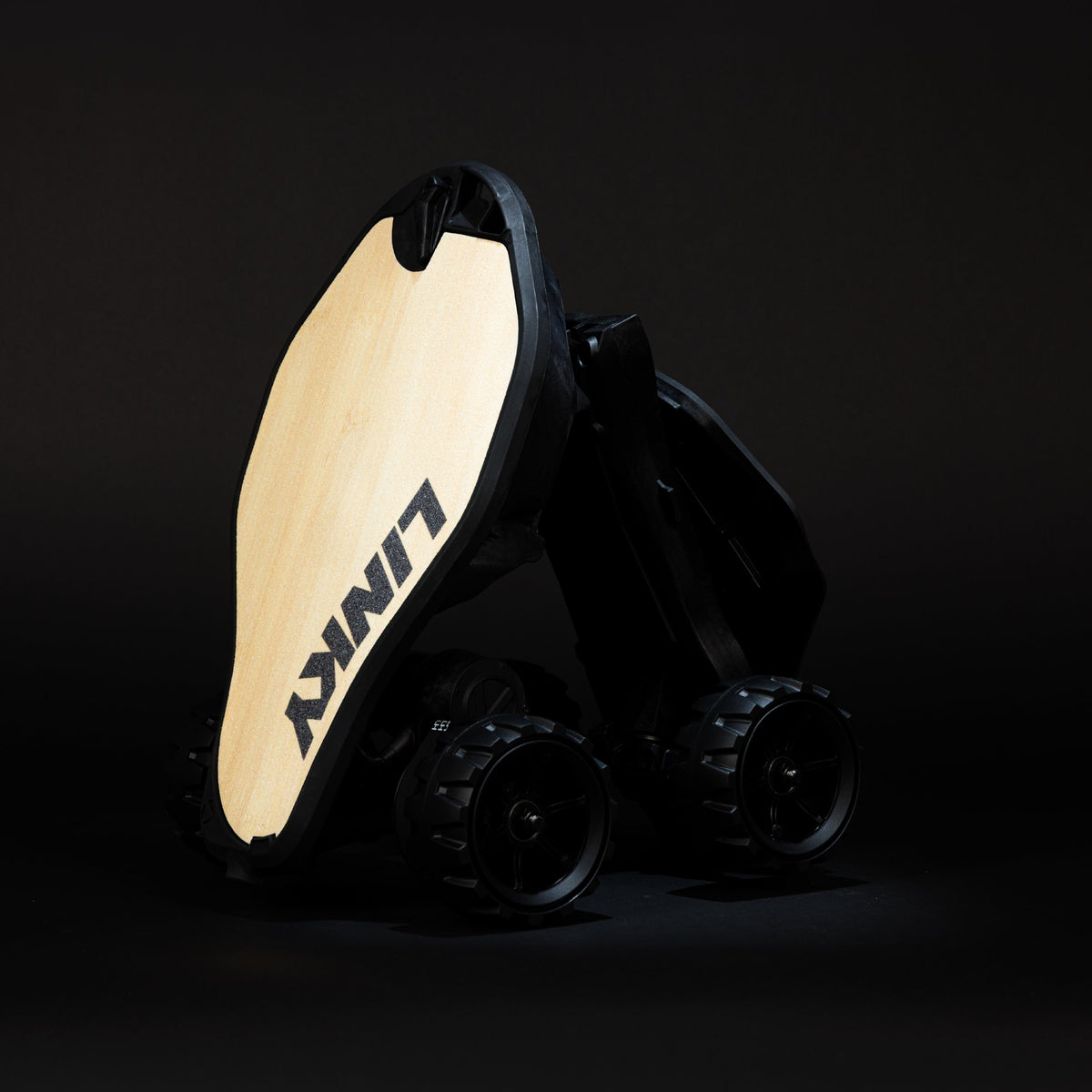 Folded Linky 2.0 electric skateboard with bamboo finish standing upright.