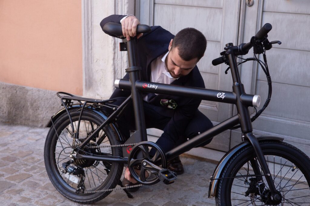 man adjusting electric bike